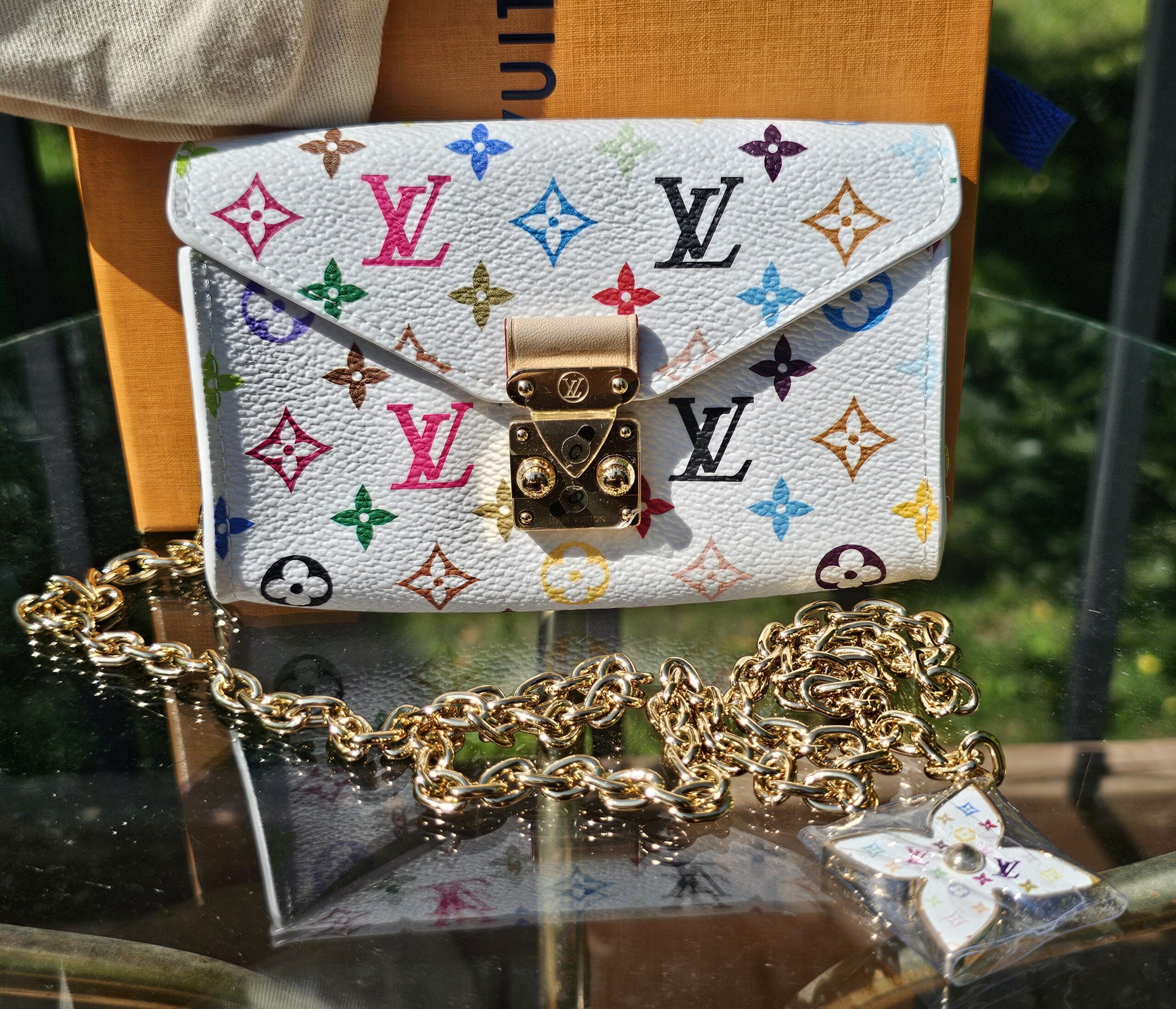 Louis Vuitton x Takashi Murakami Monogram Multicolor Pouch Metis Belt White - the pouch with its gold-tone chain and Flowergram charm