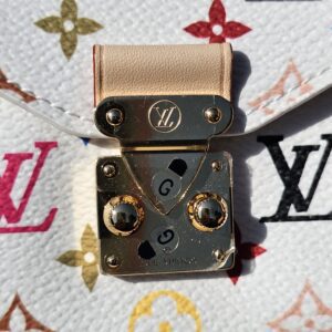 Gold-tone S-lock closure with its vachetta tab on the Multicolor canvas