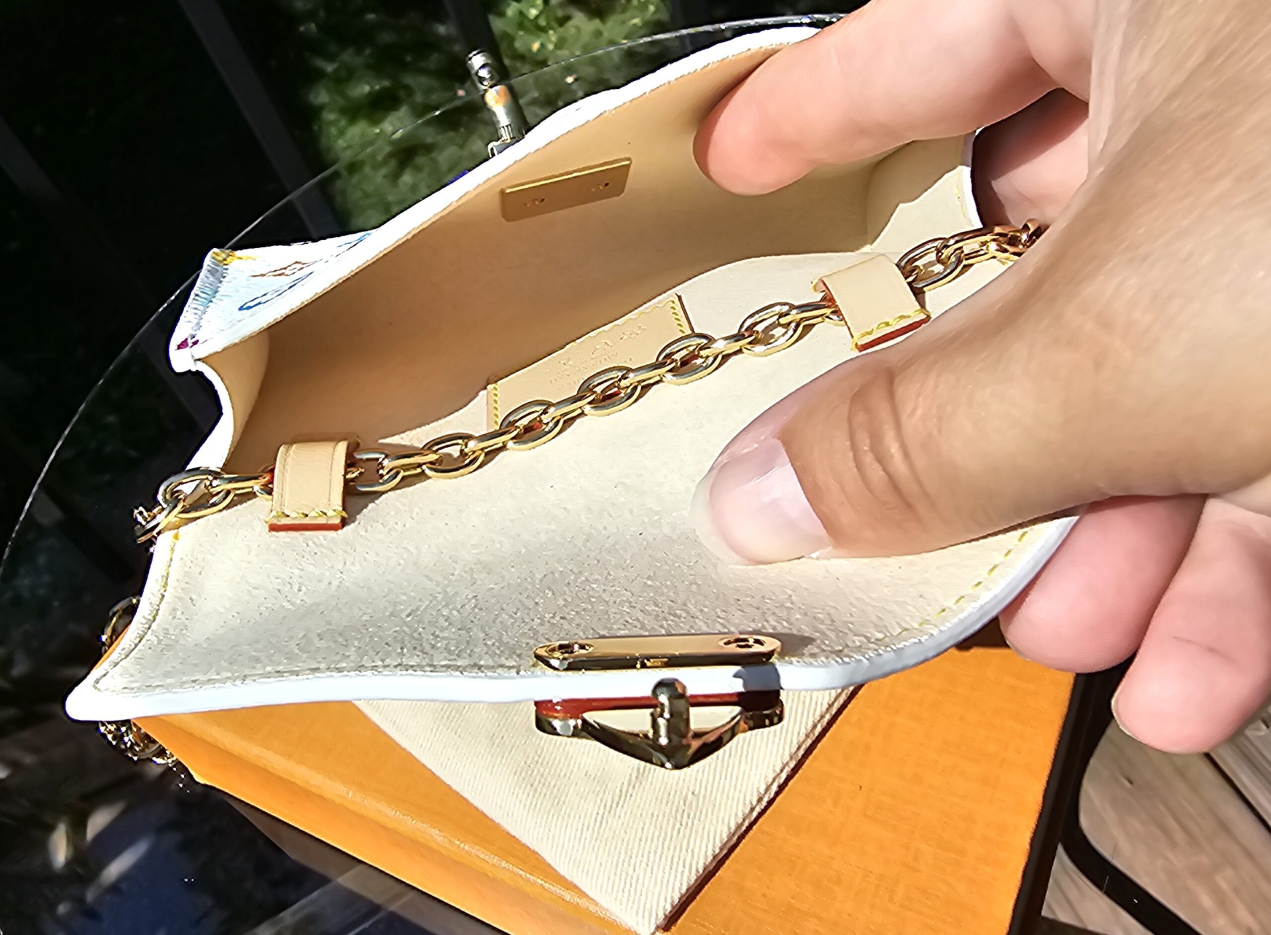 Pouch held open to show the clean cream interior