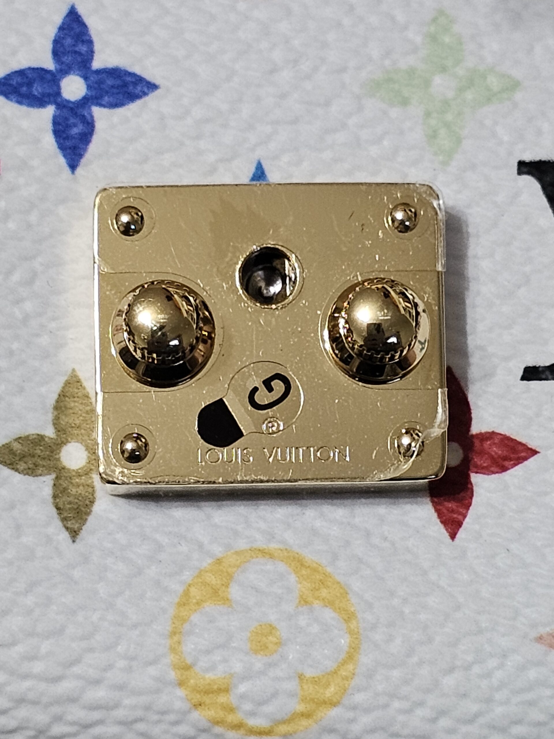 Gold-tone S-lock plate engraved LOUIS VUITTON