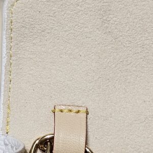 Interior vachetta tab inside the flap