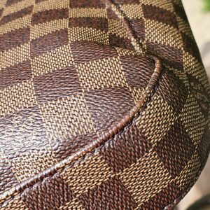Damier Ebene canvas of the Louis Vuitton South Bank Besace showing no cracking
