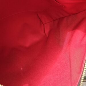 Red lining inside the Louis Vuitton Damier Ebene South Bank Besace