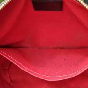 Interior pocket of the Louis Vuitton South Bank Besace in red textile