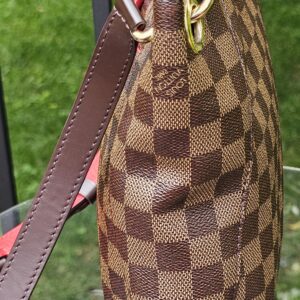 Side profile of the Louis Vuitton South Bank Besace with the strap attached