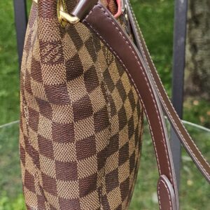 Louis Vuitton South Bank Besace shown from the side with the strap at shoulder length