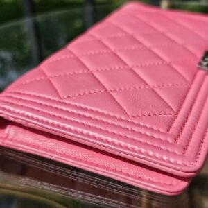Side profile of the Chanel Boy long wallet showing the puffy quilted leather