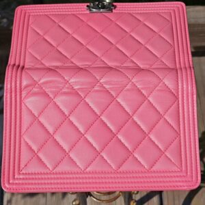 Quilted pink leather inside the flap of the Chanel Boy long wallet