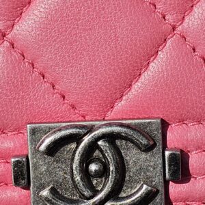 Ruthenium-tone Boy CC clasp on the pink quilted Chanel long wallet