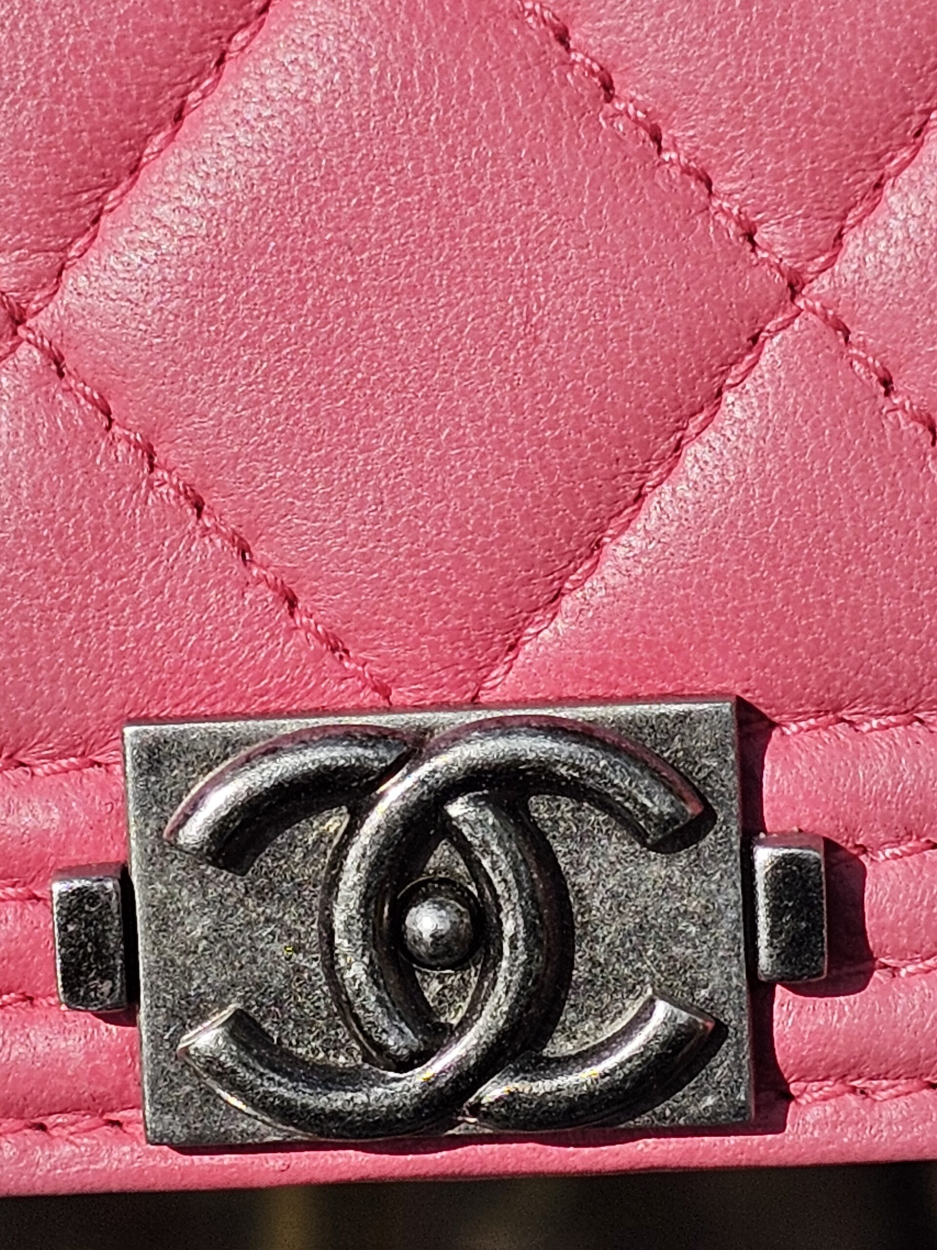 Ruthenium-tone Boy CC clasp on the pink quilted Chanel long wallet