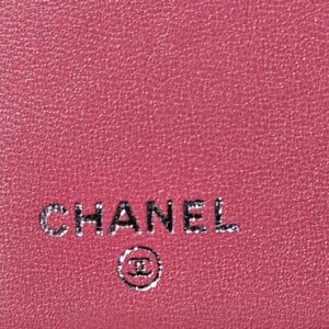 CHANEL stamped inside the pink quilted Boy long wallet