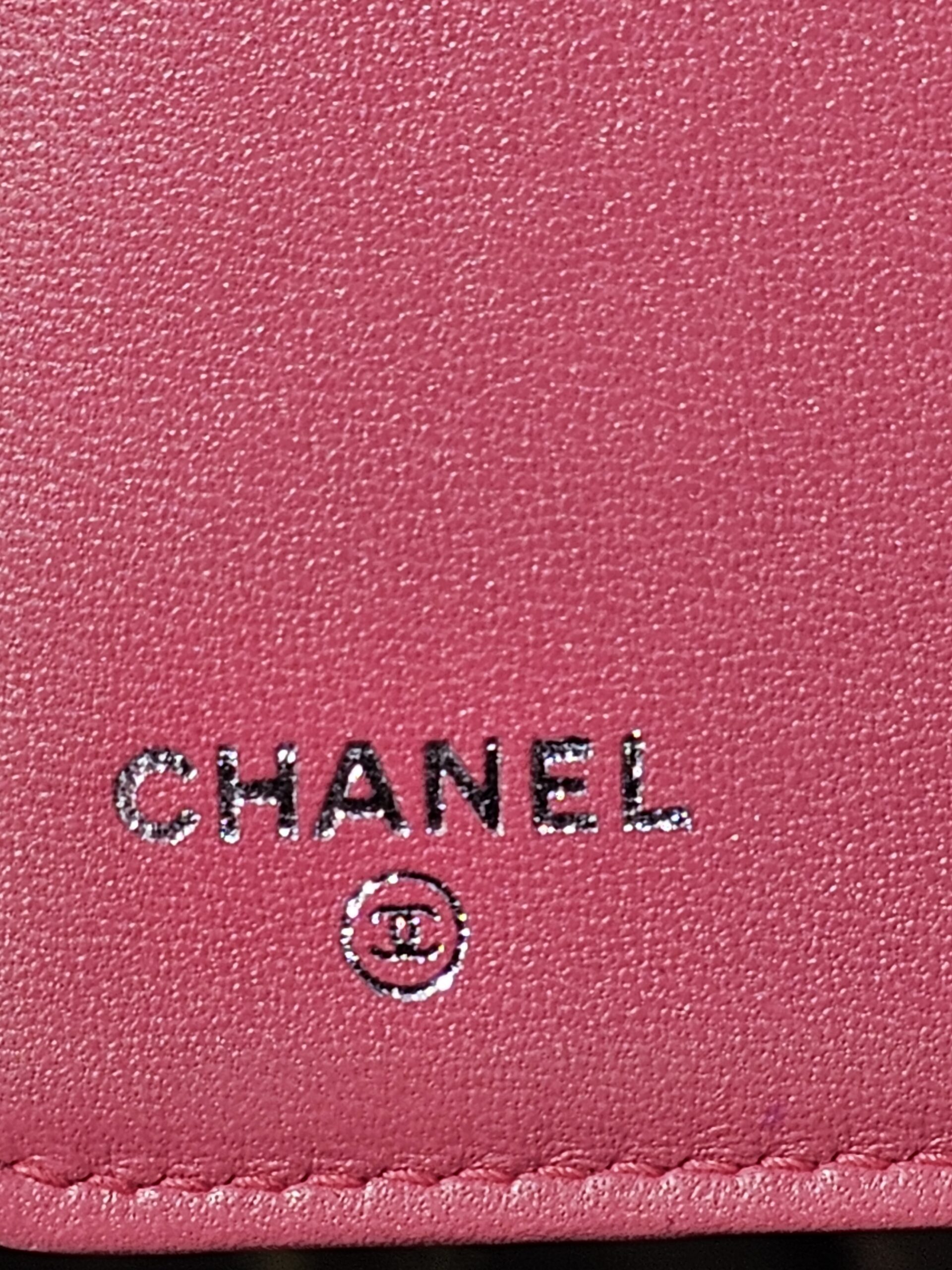 CHANEL stamped inside the pink quilted Boy long wallet