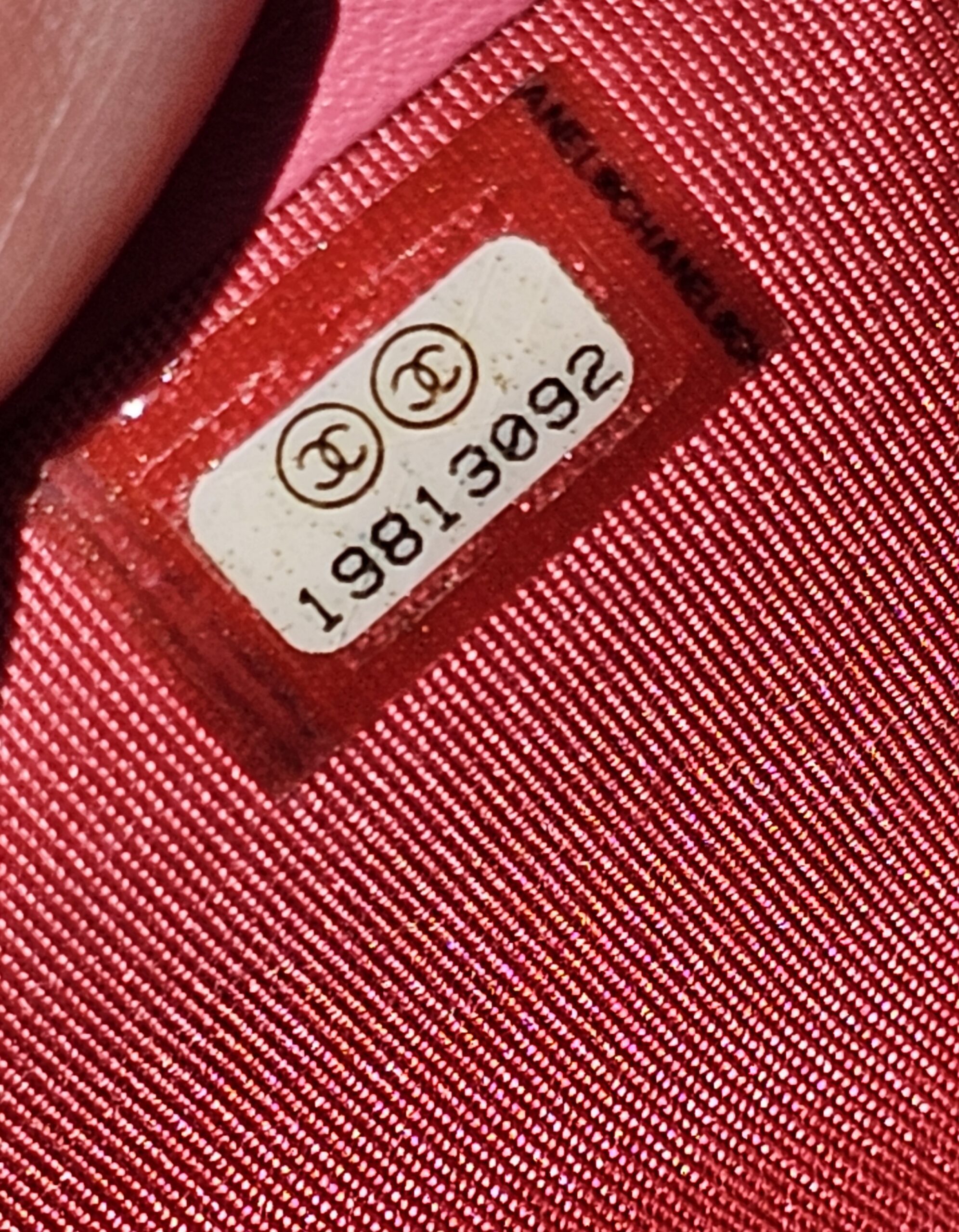 Chanel serial sticker reading 19813092 inside the pink Boy long wallet