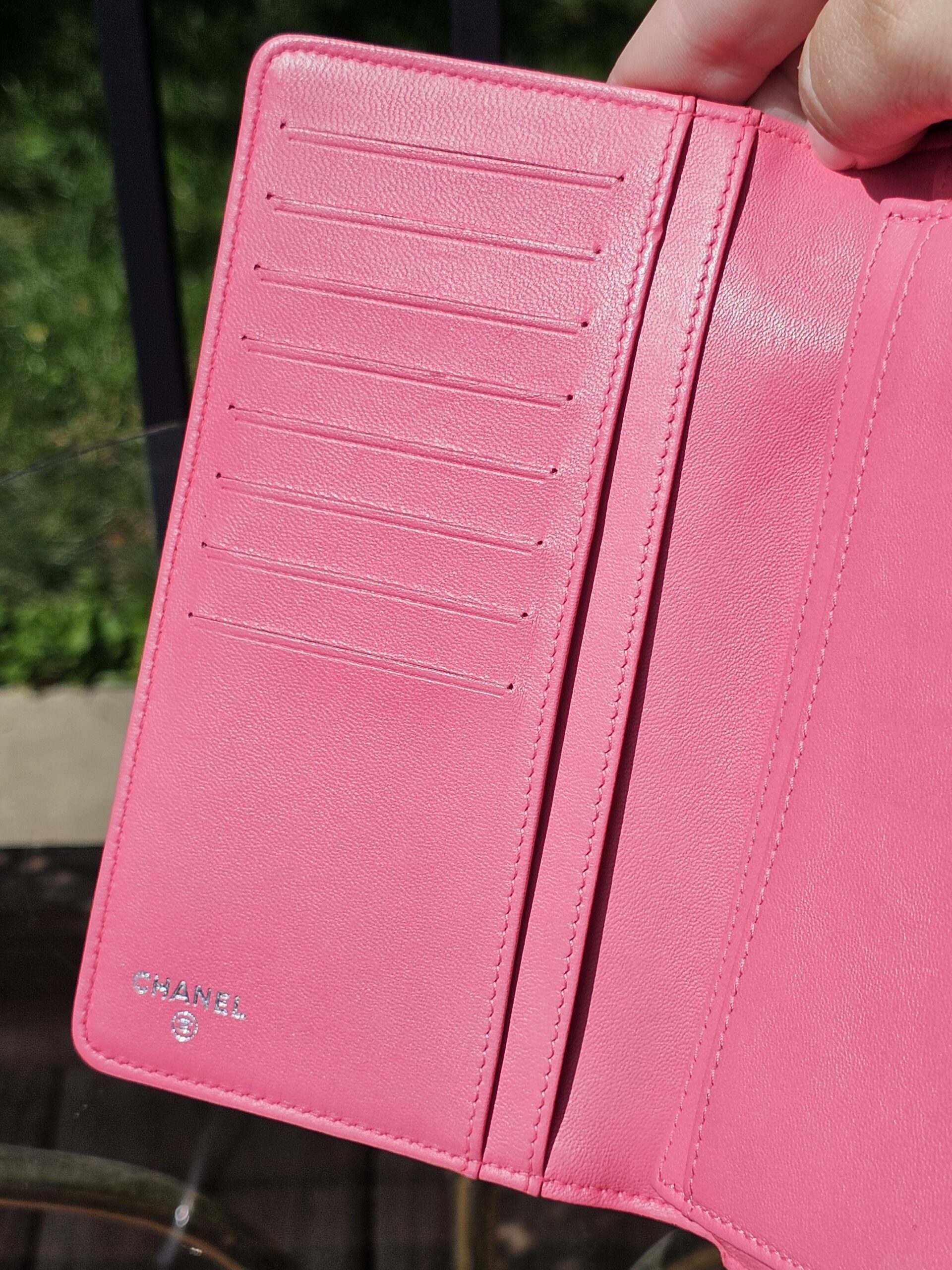 Full row of card slots inside the Chanel Boy long wallet in pink leather