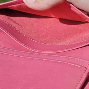 Interior bill compartment of the pink Chanel Boy long wallet