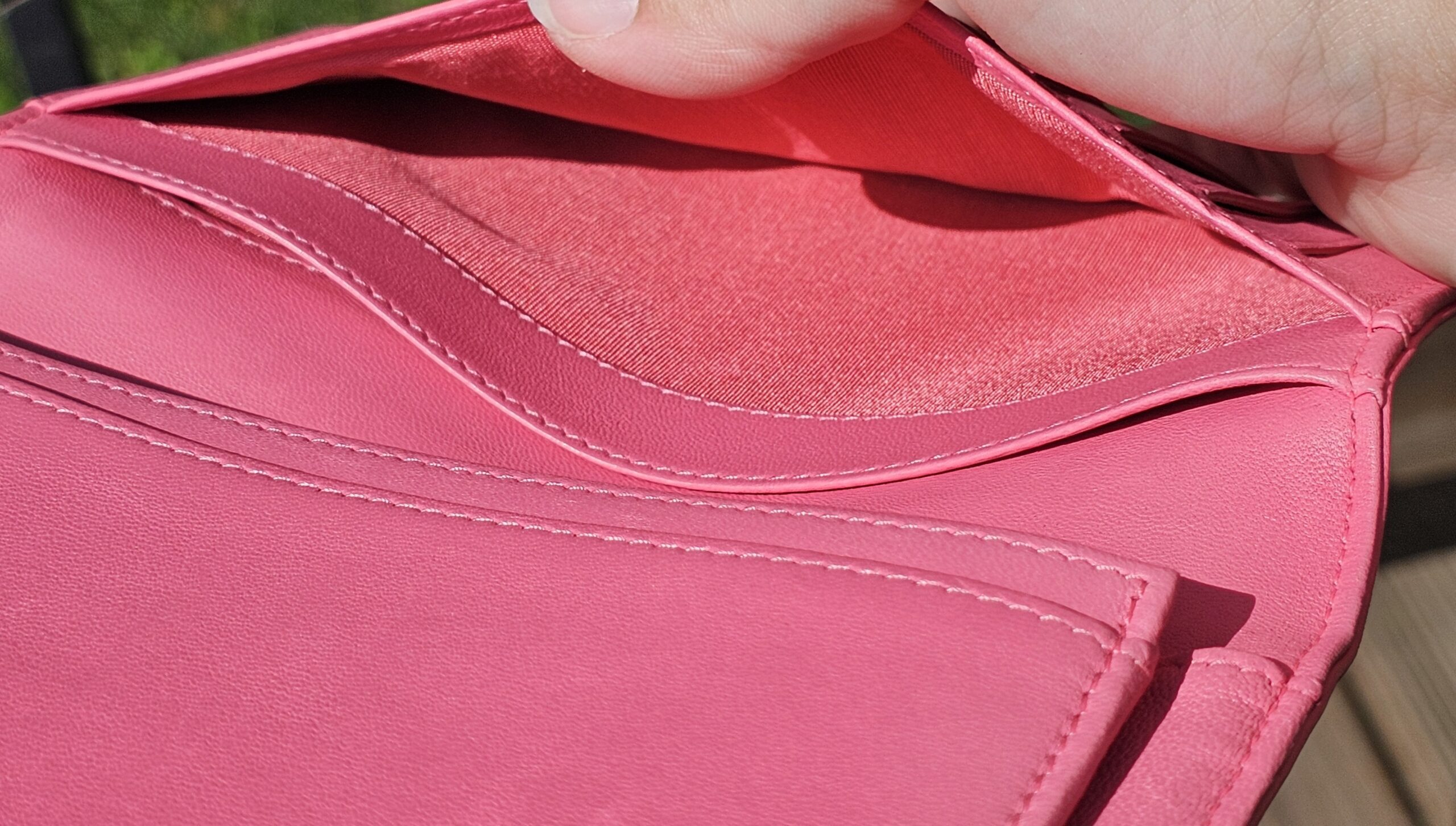 Interior bill compartment of the pink Chanel Boy long wallet