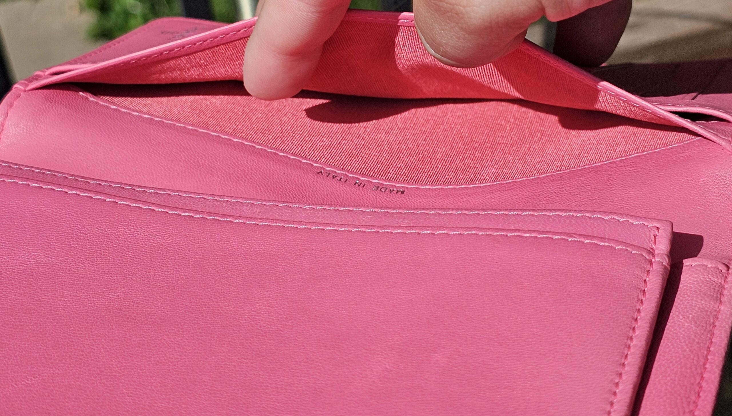Interior compartments of the Chanel Boy long wallet shown for condition