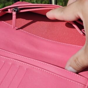 Zippered coin compartment inside the Chanel Boy long wallet