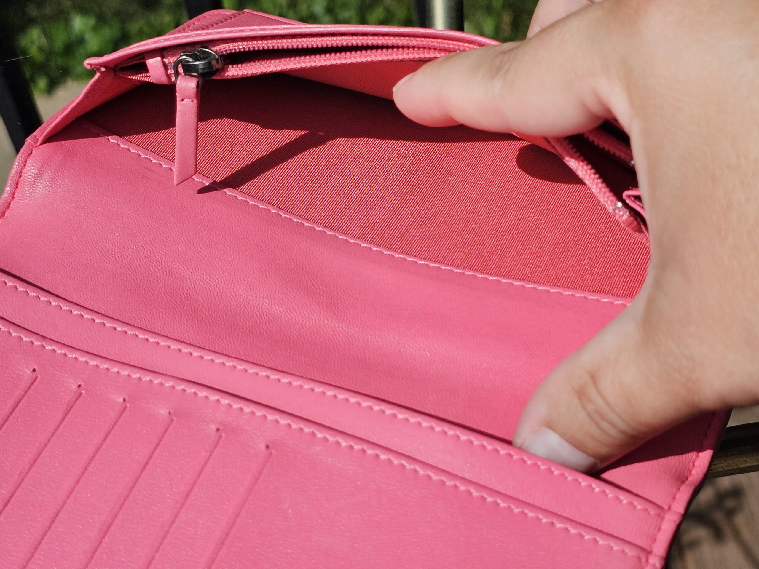 Zippered coin compartment inside the Chanel Boy long wallet