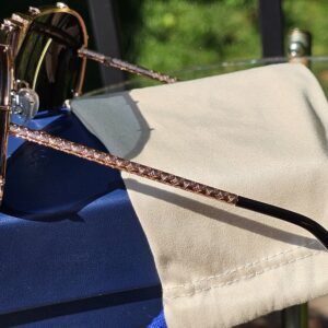 Side profile of the LV Drive sunglasses showing the rhinestone-set brow bar and black temple arm