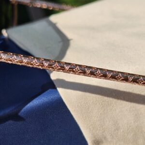 Close-up of the rhinestone-set rose gold-tone brow bar on the Louis Vuitton LV Drive sunglasses