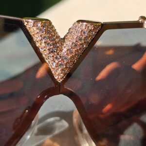 Crystal-embellished V centerpiece at the bridge of the Louis Vuitton LV Drive sunglasses