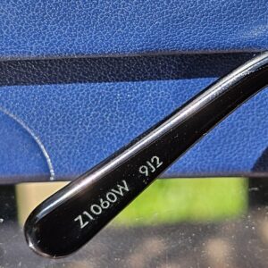 Left temple of the LV Drive sunglasses engraved with the Louis Vuitton model reference Z1060W and color code 912