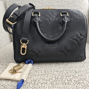 Louis Vuitton Monogram Empreinte Giant Speedy Bandoulière 25 Black - shown with its strap, lock, keys and dust pouch