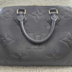 Front view of the black Giant Monogram Empreinte Speedy Bandouliere 25 with gold-tone hardware