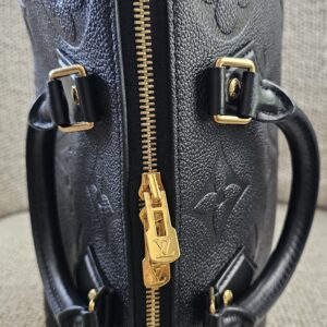 Top-down view of the black Empreinte Speedy Bandouliere 25 showing the double zip closure