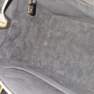 Interior slip pocket in the gray lining of the Empreinte Speedy Bandouliere 25