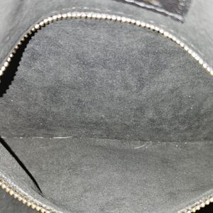 Zip pocket inside the gray lining of the black Empreinte Speedy Bandouliere 25