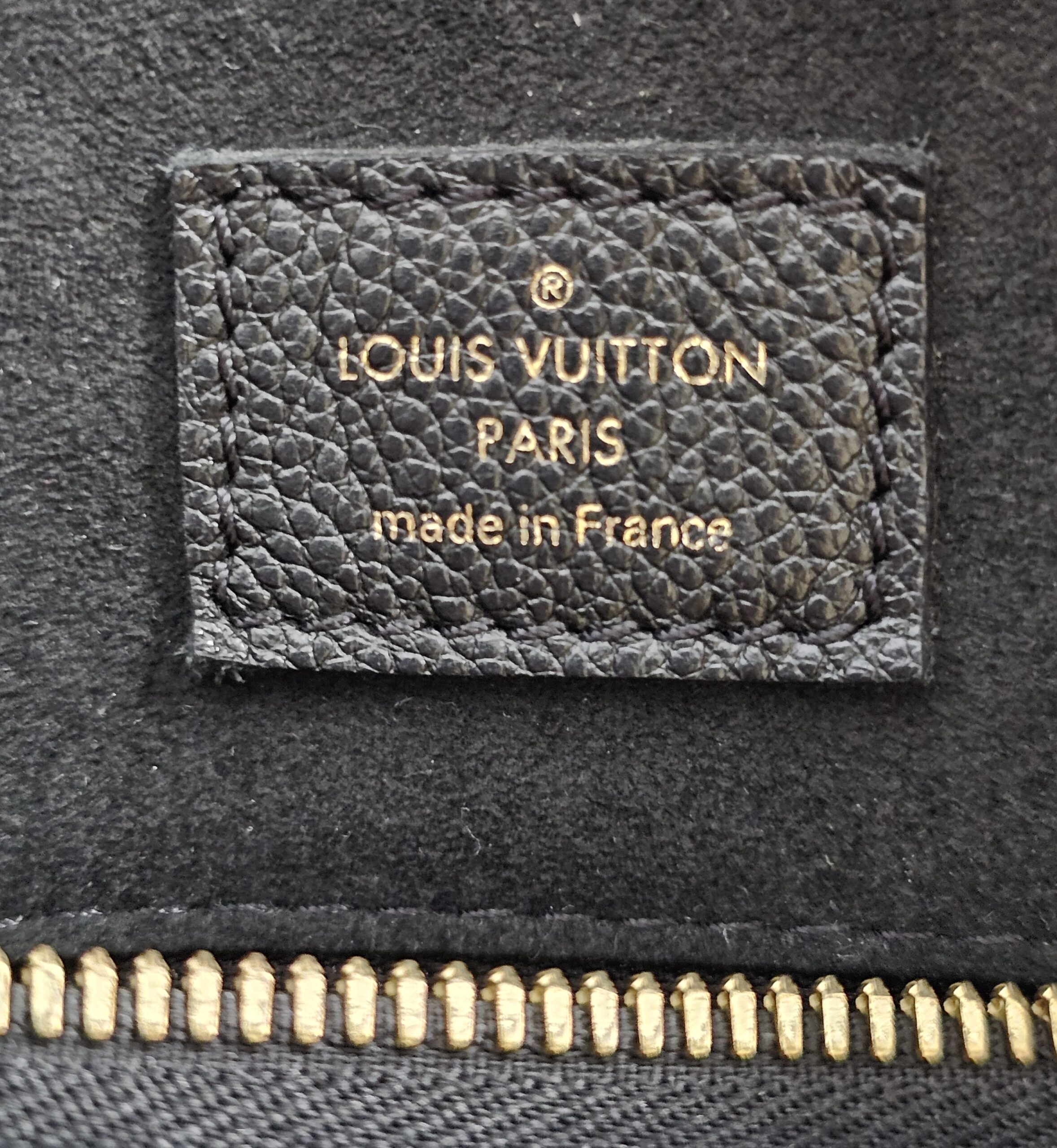 LOUIS VUITTON PARIS made in France heat stamp inside the black Empreinte Speedy Bandouliere 25