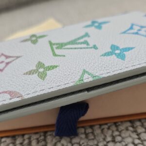Slim side profile of the Louis Vuitton Iridescent Gradient Pocket Organizer