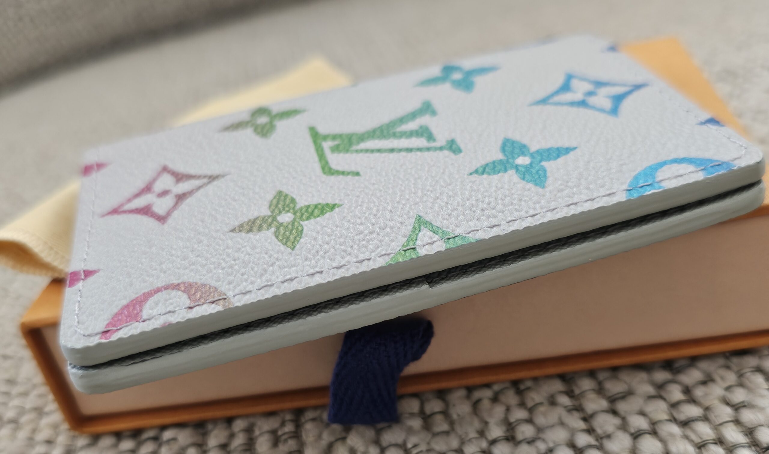 Slim side profile of the Louis Vuitton Iridescent Gradient Pocket Organizer