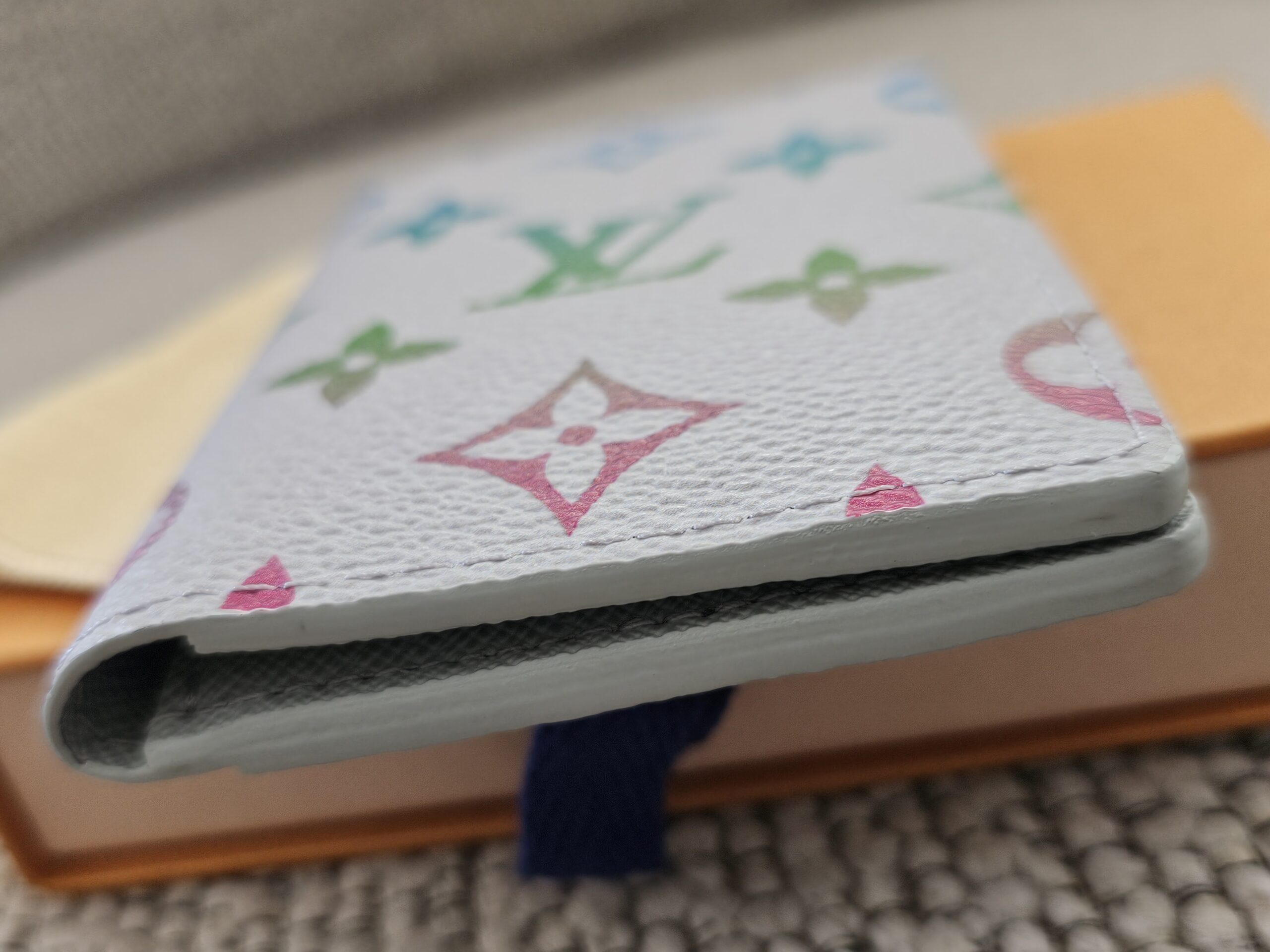 Angled view of the Louis Vuitton Pocket Organizer in Monogram Iridescent Gradient canvas