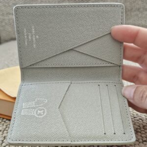 Gray leather interior and card slots of the Louis Vuitton Iridescent Gradient Pocket Organizer
