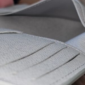 Close-up of the gray leather card slots inside the Louis Vuitton Pocket Organizer