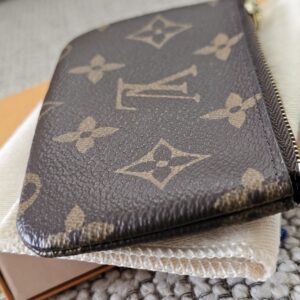 Angled view of the Monogram Key Pouch showing the canvas and glazed edges