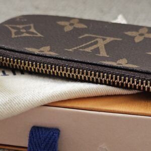 Zip-top closure of the Monogram Key Pouch