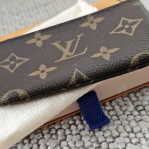 Monogram Key Pouch resting on its Louis Vuitton box