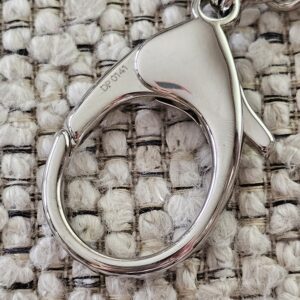 Polished silver-tone lobster clasp on the Louis Vuitton Bijoux Sac Fleur de Epi bag charm