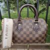 Louis Vuitton Damier Ebene Speedy Bandoulière 20 - shown with its jacquard shoulder strap and dust bag