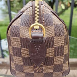 Louis Vuitton Speedy Bandouliere 20 front with the embossed leather name tab visible