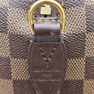 LOUIS VUITTON PARIS made in France heat stamp embossed on the leather tab of the Speedy Bandouliere 20