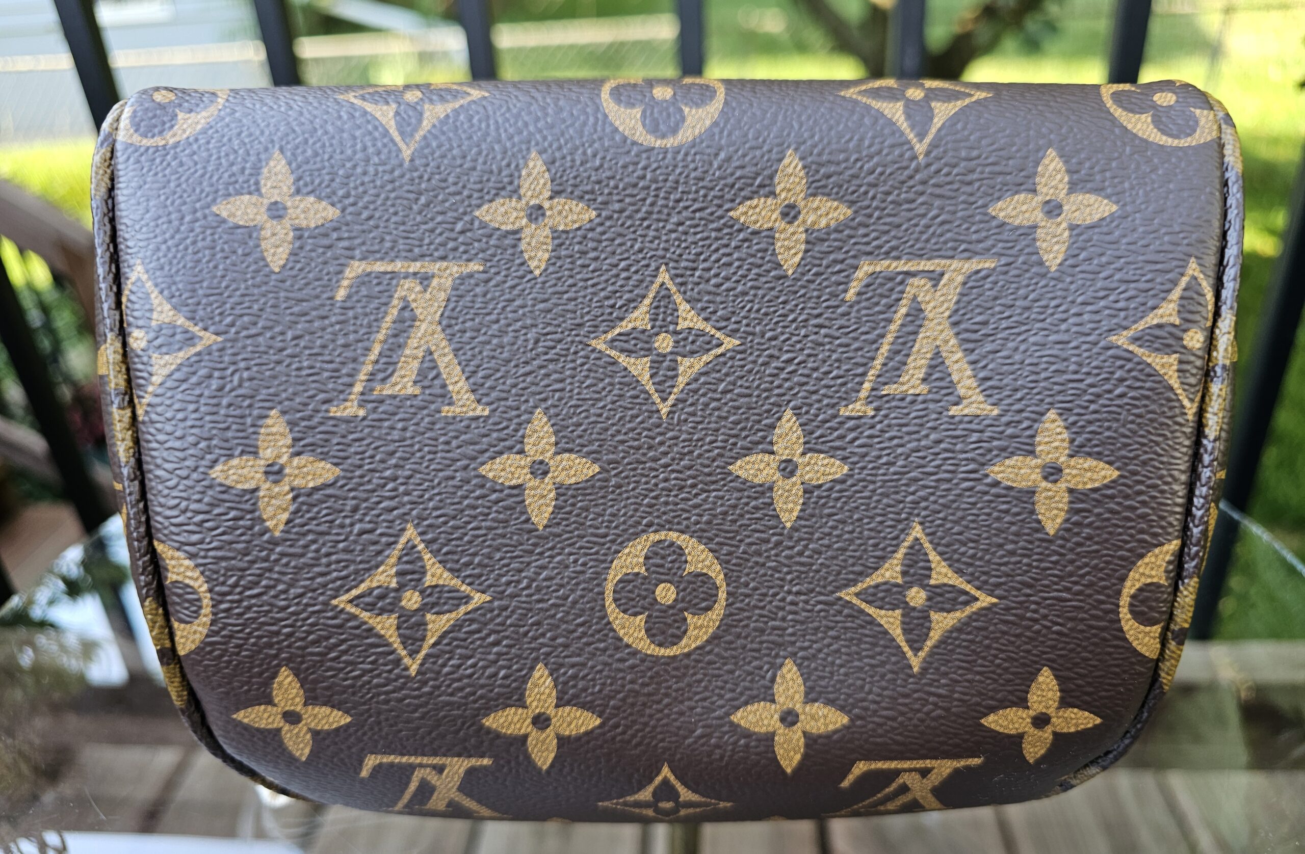 Reverse of the Louis Vuitton Cerises Mini Bumbag in plain Monogram coated canvas