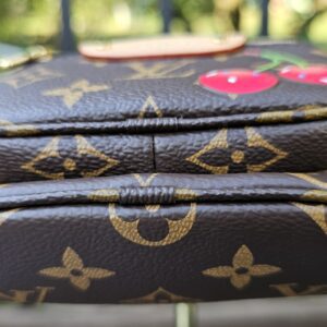 Top view of the Monogram Cerises Mini Bumbag with the cherry motif visible
