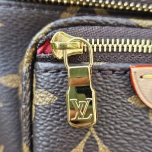 Gold-tone LV zip pull on the Monogram Cerises Mini Bumbag