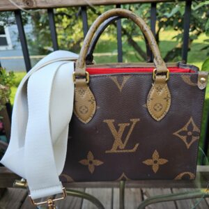 Louis Vuitton Reverse Monogram Giant OnTheGo PM shown with an aftermarket white crossbody strap