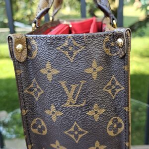 Opposite side panel of the Giant Reverse Monogram OnTheGo PM